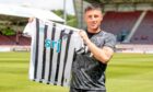 Michael O'Halloran poses with a Dunfermline Athletic