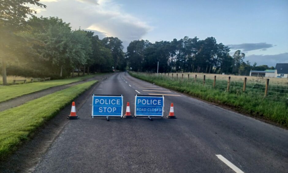 Road closed signs on the road heading to the blue door walk at the park at Edzell. 