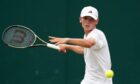 Charlie Robertson in action during his boys singles match on day six of the 2023 Wimbledon Championships at the All England Lawn Tennis and Croquet Club in Wimbledon. Picture date: Saturday July 8, 2023.