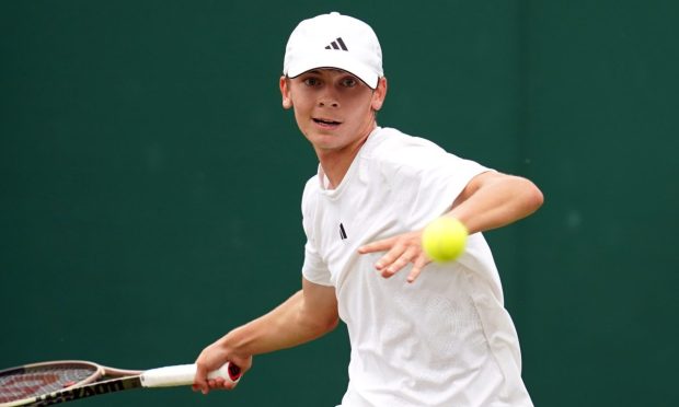 Charlie Robertson in action at Wimbledon in 2023. Image: PA