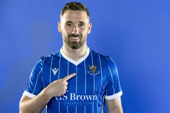 Nicky Clark models the new, pinstriped St Johnstone kit. Image: Graeme Hart/Perthshire Picture Agency