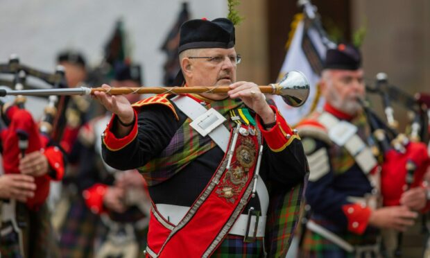 Drum Major Alister Walker leading the Atholl Highlanders pipe band