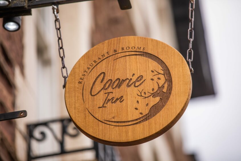 A Coorie Inn sign.