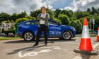 Marian stands beside the Dunkeld EV chargers