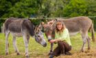 Karen Inkster with two donkeys.