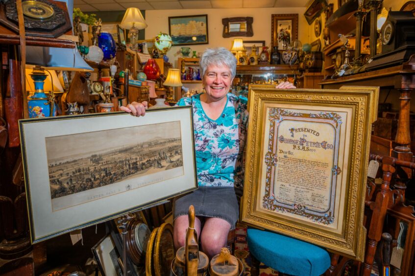 Angus bookseller Hilary Farquarson with rare items.