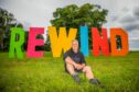 Steve Porter seated in front of Rewind festival sign at Scone Palace.