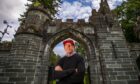 Tom Collopy, Discovery Land Company's chief project officer at Taymouth Castle, standing in front of the imposing stone gates.