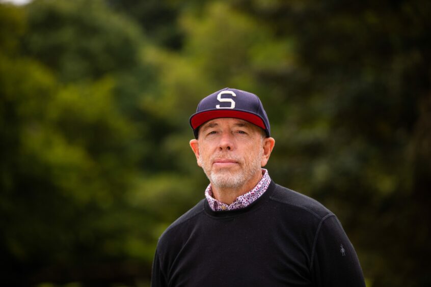 Tom Collopy, Discovery Land Company's chief project officer at Taymouth Castle, in sweater and baseball cap.