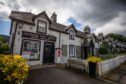 Kenmore village shop, at end of row of pretty whitewashed cottages