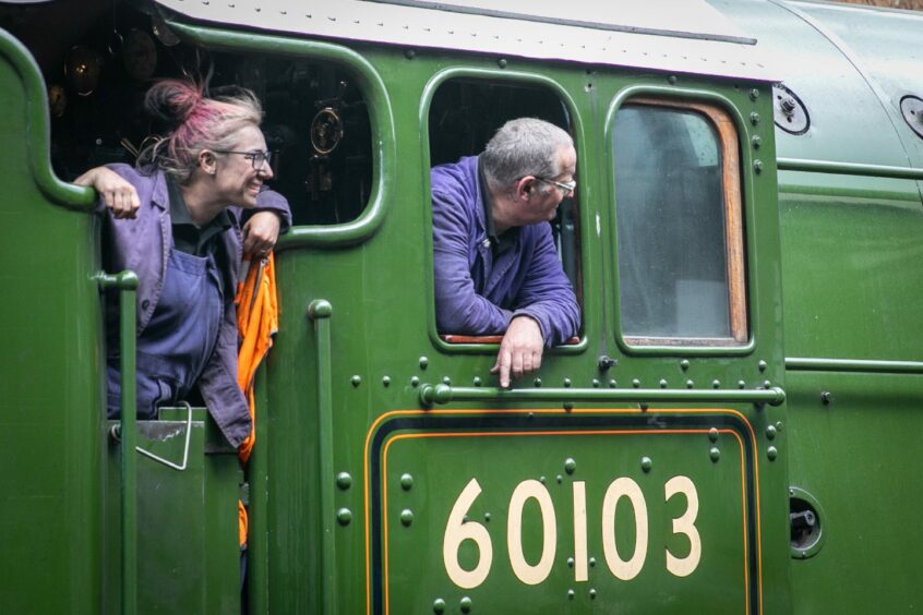 Workers on the locomotive. Image: Steve Brown/DC Thomson.
