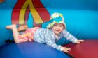 Persephone Barkla-Webb, from St Andrews, enjoys the bouncy castle. Image: Steve Brown/DC Thomson