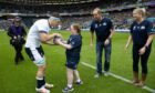 Caitlin delivers the match ball to Scotland captain Rory Darge with parents Ashley and Liam.