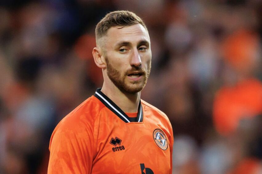 Louis Moult in action for Dundee United against Partick Thistle