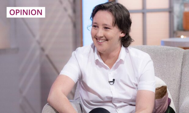 Smiling Mhairi Black in white short sleeved shirt on the set of the Lorraine TV show.