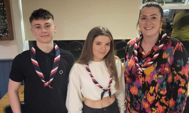 Dundee Explorers Cadeyrn Harris and Lilly Hosie with unit leader Stacey McPherson-Kennedy. Image: Scouts Scotland