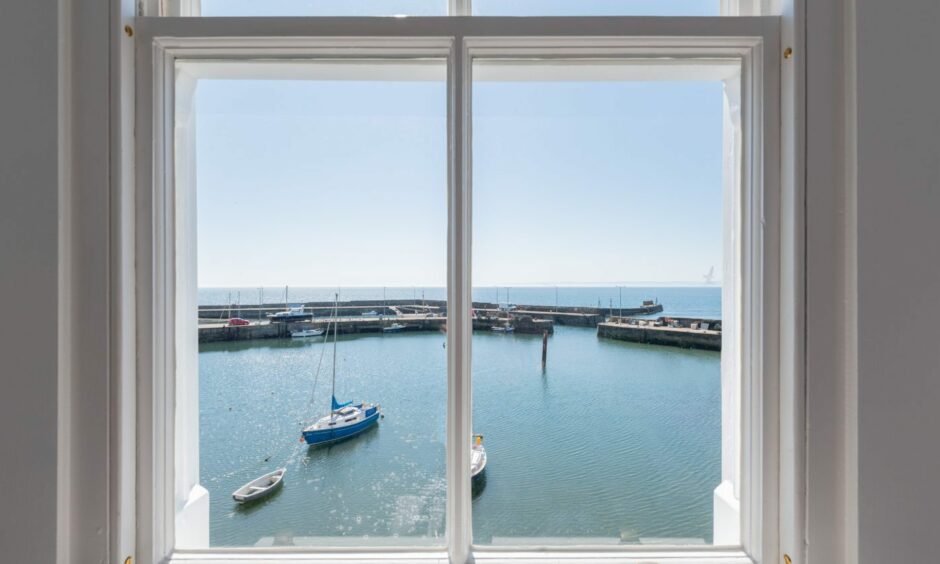 View of St Monans Harbour from a window in the East Neuk house.