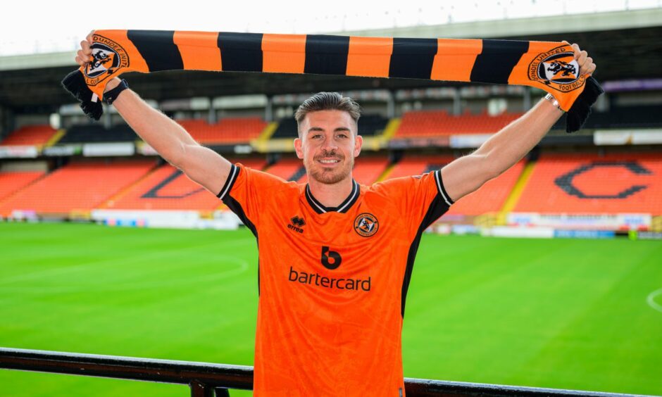 Declan Gallagher poses after being unveiled by Dundee United