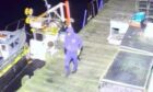 CCTV shows a man damaging the boat with a drill. Image: Methil Boat Club