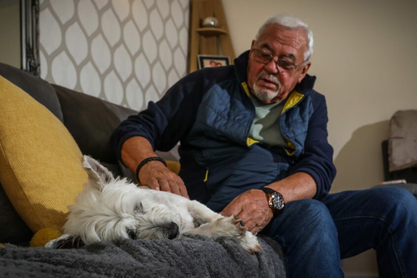 John and Charlie at home. John says he is still in shock. Image: Mhairi Edwards/DC Thomson