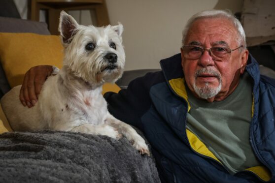 John and Charlie recovering at home after the earlier attack.  Image: Mhairi Edwards/DC Thomson.