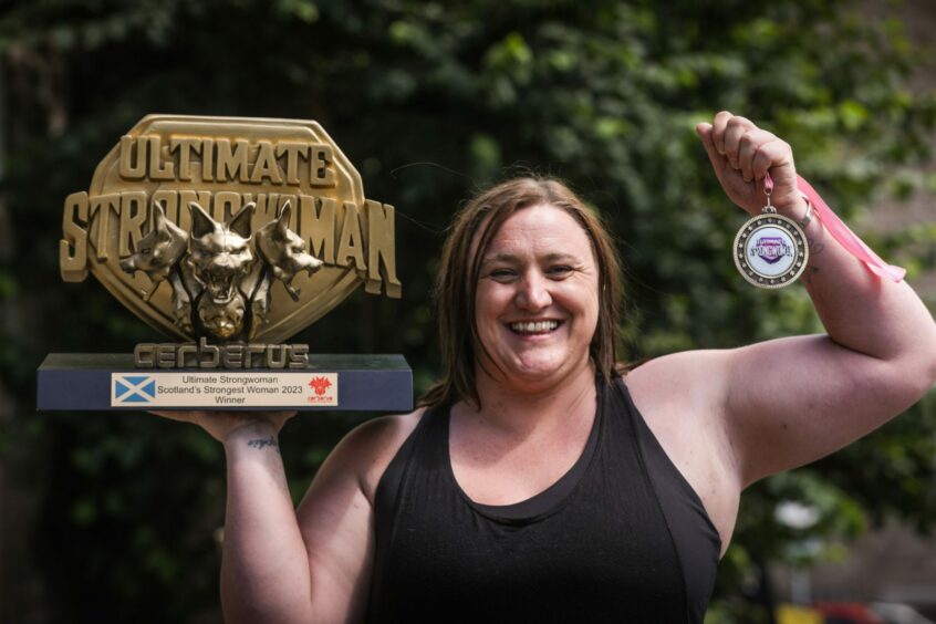 Dundee mum Izzy Tait (42) who has overcome the challenges of brain separation syndrome and epilepsy to win the title of Scotland's Strongest Woman.