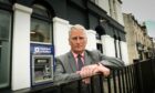 Councillor Craig Duncan outside the now closed RBS branch in Broughty Ferry. Image: Mhairi Edwards/DC Thomson