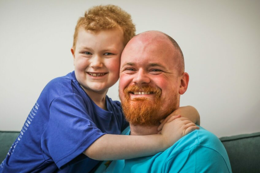 Proud dad Greg Stewart with his son Sandy who is battling a brain tumour. Image: Mhairi Edwards/DC Thomso