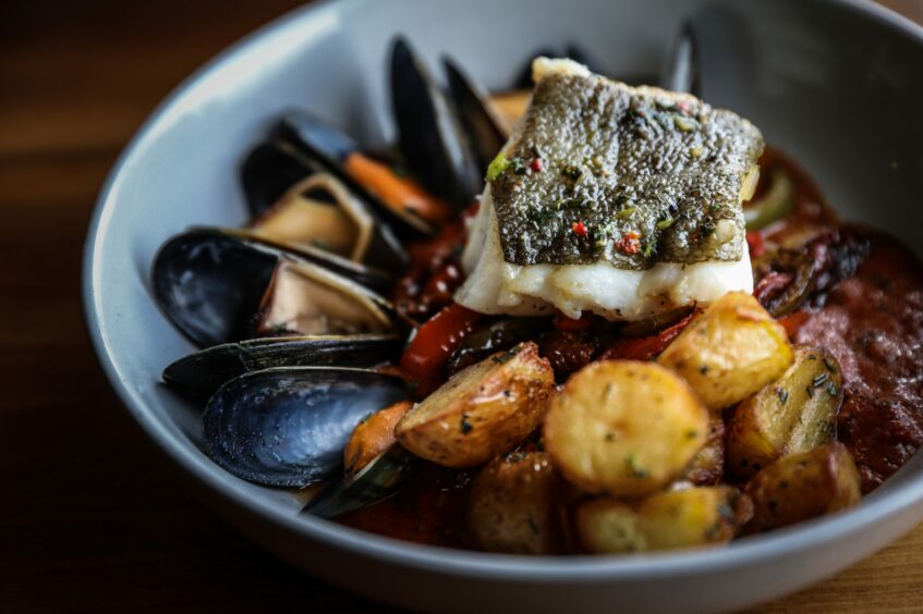 Catch of the day - pan-fried cod, mussels, roast potatoes and a tomato and pepper sauce served up by St Michaels Inn.