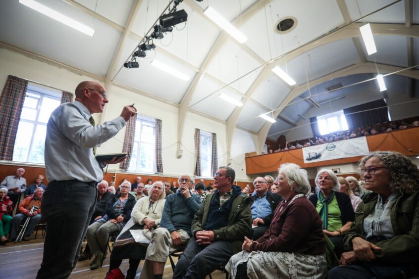 John Swinney MSP addresses a large crowd at the public meeting about the Taymouth Castle plans in Aberfeldy