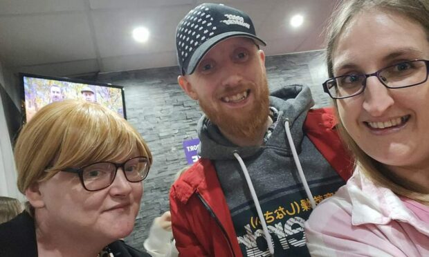 Brechin motorcyclist Darien Baird with partner Terri Beattie, left, and sister Allannah Logan