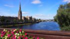 A photo of the city of Perth and the River Tay from a bridge.