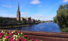 A photo of the city of Perth and the River Tay from a bridge.