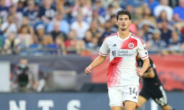 Ian Harkes in full flow for New England Revolution against Wayne Rooney's DC United