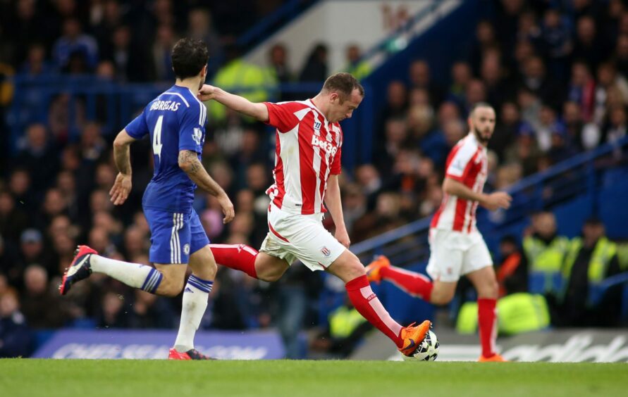 Charlie Adam scores from his own half for Stoke City at Chelsea in 2015.