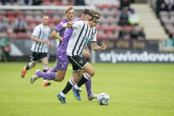 Matty Todd started the season in a protective mask. Image: Craig Brown/DAFC.