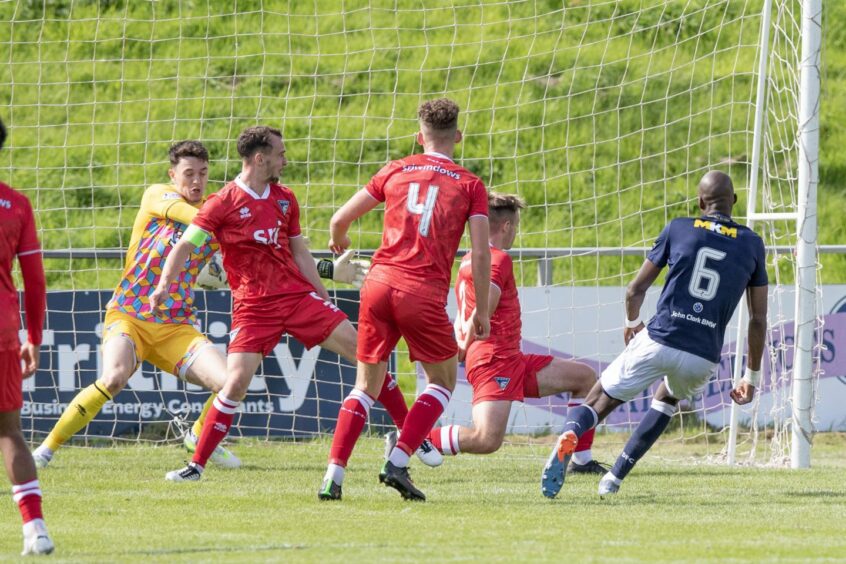 Mo Sylla scores the only goal of the game. Image: Craig Brown/DAFC.