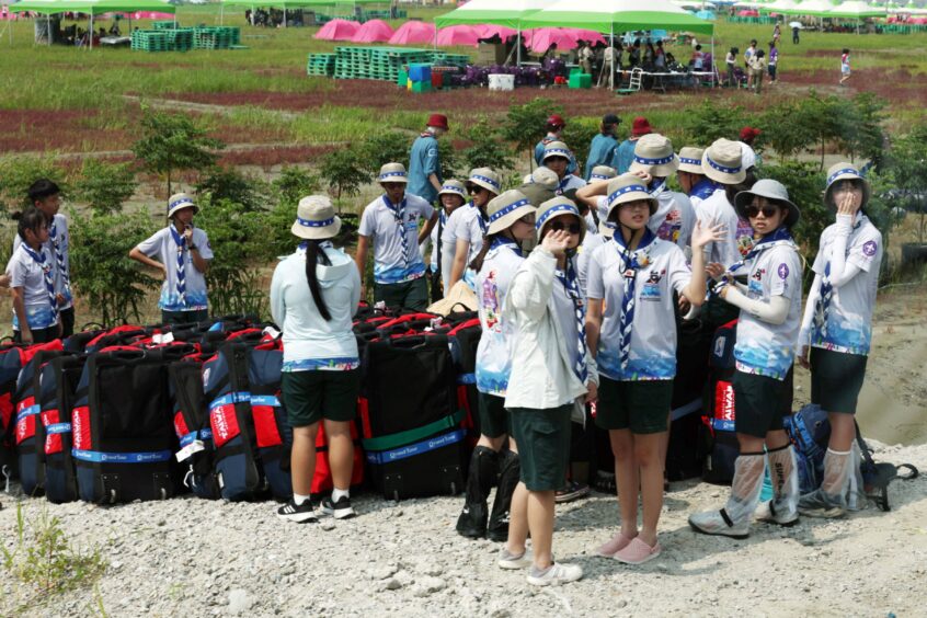 International attendees of the 25th World Scout Jamboree arrive at a scout camping site in the Saemangeum reclamation area in Buan, North Jeolla Province, on South Korea's west coast, Image: Shutterstock.