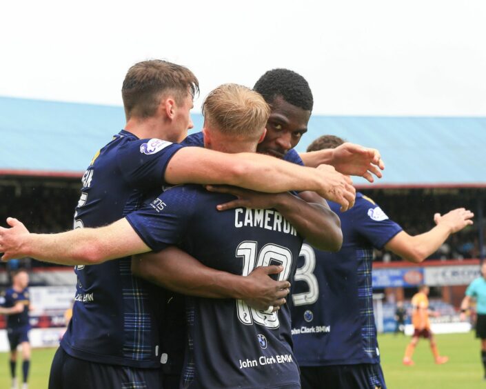 Dundee celebrate after Lyall Cameron made it 1-1.