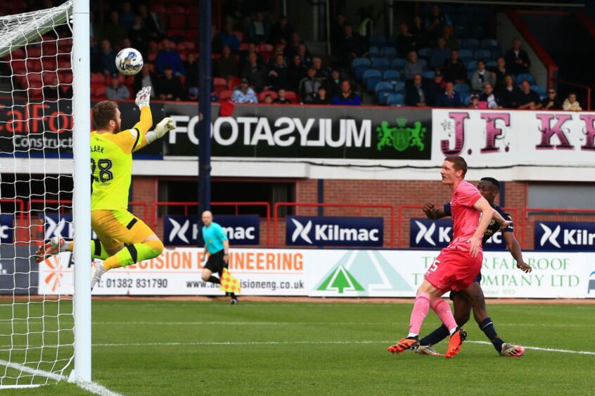 Zach Robinson sees his header saved by Zander Clark. Image: David Young/Shutterstock