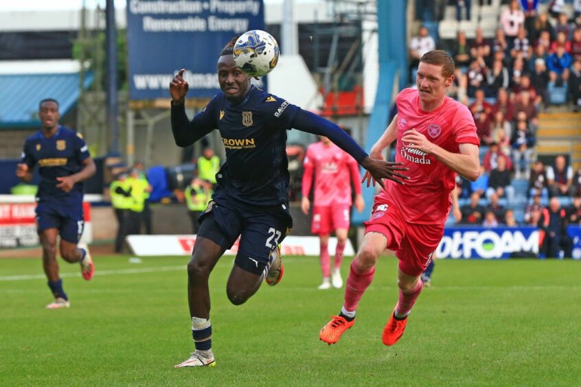 Dundee FC midfielder Malachi Boateng takes on Kye Rowles. Image: David Young/Shutterstock