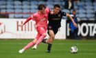 Cammy Kerr battles with Alex Lowry as Dundee beat Hearts. Image: David Young/Shutterstock