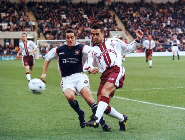 Annand will be at Dens Park for Sunday's clash with Hearts. Picture shows him playing for Dundee against Hearts.