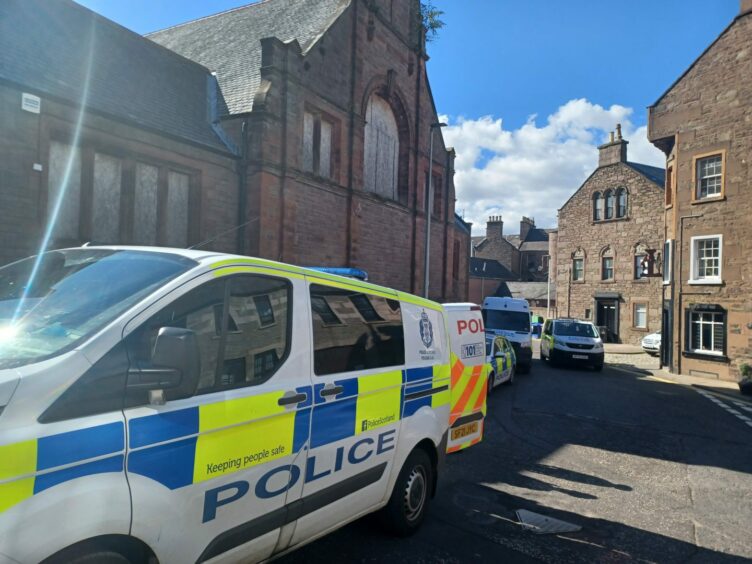 Police outside old Forfar swimming pool.