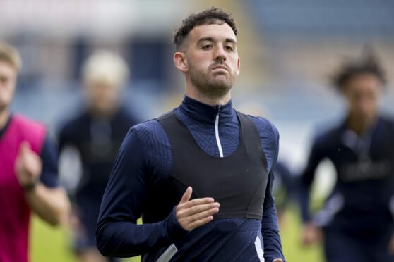 Raith Rovers midfielder Shaun Byrne, on loan from Dundee, warms up before a match. Image: SNS.