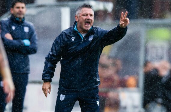 Dundee boss Tony Docherty in the rain at Dens Park. Image: SNS