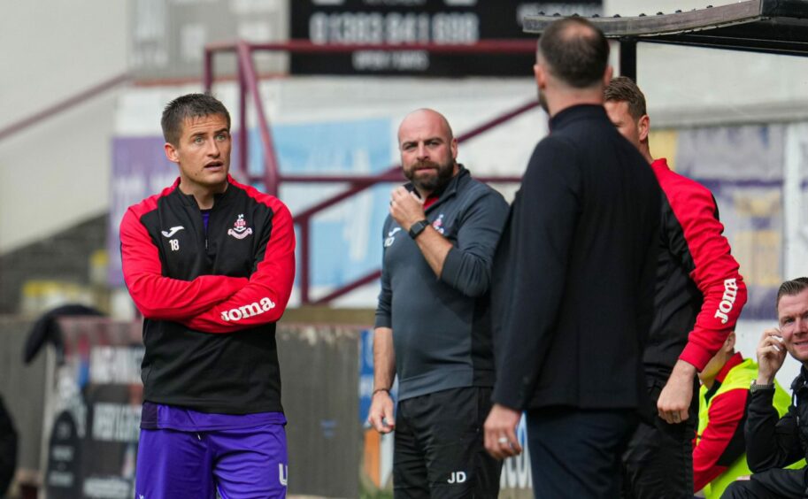 Airdrieonians manager Rhys McCabe, left, exchanges words with Dunfermline boss James McPake