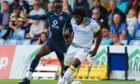 St. Johnstone's Daniel Phillips and Ross County's Victor Loturi in action.