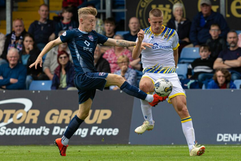 Ross County's Kyle Turner and St Johnstone's Sam McClelland in action.