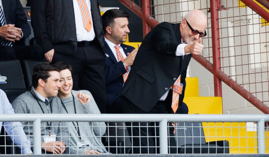 Mark Ogren, right, as Dundee United CEO Luigi Capuano looks on.